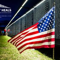 Flag in front of Wall That Heals