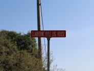 Claiborne Kyle Log House Rd. sign