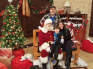 Santa visits with families