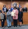 Council and community members presenting proclamation